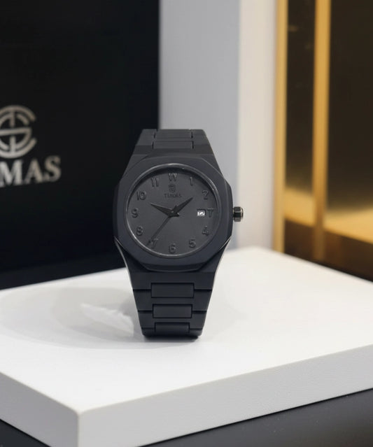 Black watch on a white surface with a blurred background